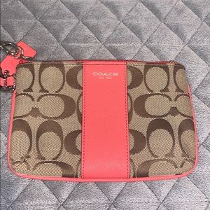 Coach tan and coral/ peach wristlet